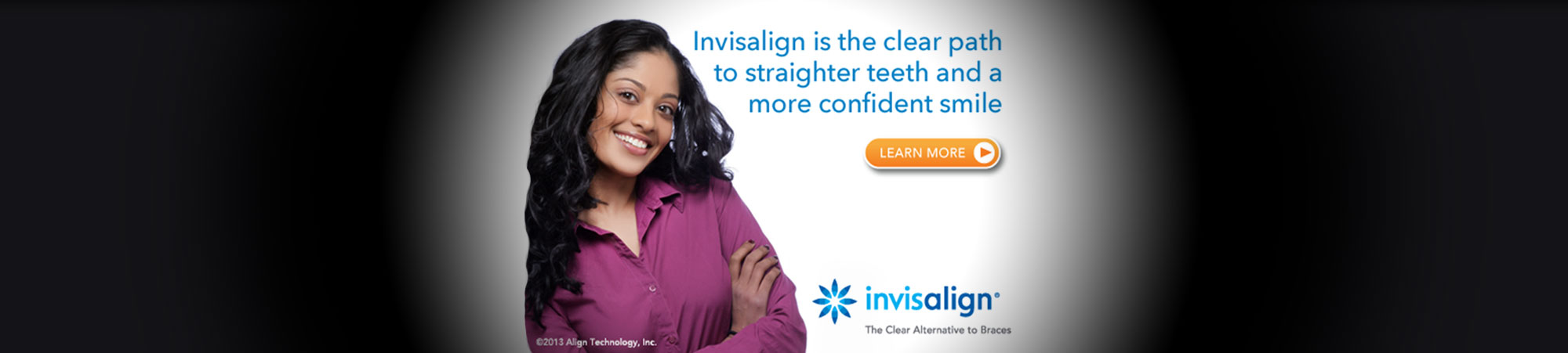 Girl in a purple shirt smiling with Invisaline